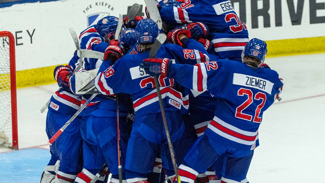 Aug 3, 2024; Plymouth, MI, USA; Team USA celebrates their O.T. shootout win over Canada during the of the 2024 World Junior Summer Showcase at USA Hockey Arena. Mandatory Credit: David Reginek-USA TODAY Sports
