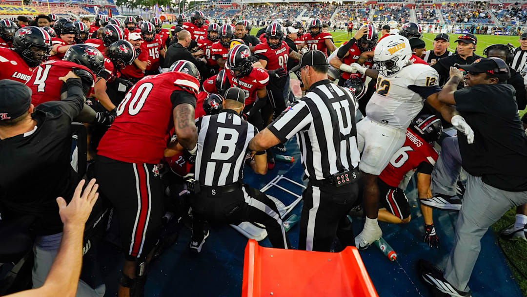 A skirmish breaks out between the Louisville Cardinals and the Toledo Rockets during the fourth quarter of the Boca Raton Bowl