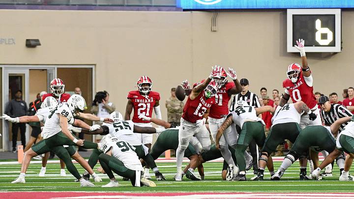 Oct 18, 2025; Bloomington, Indiana, USA; Indiana Hoosiers linebacker Kellan Wyatt (13) attempts to block a field goal during the second half against the Michigan State Spartans at Memorial Stadium. Mandatory Credit: Robert Goddin-Imagn Images