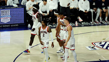 Dec 2, 2023; Tucson, Arizona, USA; Arizona Wildcats guard Caleb Love (2), center Oumar Ballo (11), forward Keshad Johnson (16), guard Pelle Larsson (3), and guard Kylan Boswell (4) walk back onto the court after a timeout during the first half at McKale Center. Mandatory Credit: Zachary BonDurant-Imagn Images