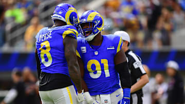 Oct 6, 2024; Inglewood, California, USA; Los Angeles Rams linebacker Jared Verse (8) and defensive tackle Kobie Turner (91) celebrate after sacking Green Bay Packers quarterback Jordan Love (10) during the first half at SoFi Stadium. Mandatory Credit: Gary A. Vasquez-Imagn Images