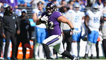Oct 22, 2023; Baltimore, Maryland, USA; Baltimore Ravens running back Patrick Ricard (42) runs the ball against the Detroit Lions during the second quarter at M&T Bank Stadium. Mandatory Credit: Mitch Stringer-Imagn Images
