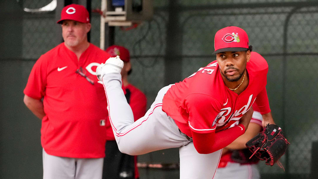 Cincinnati Reds pitcher Hunter Greene (21) throws a bullpen session with pitching coach/director of pitching Derek Johnson (36) at the Cincinnati Reds player development complex in Goodyear, Ariz., on Friday, Feb. 13, 2026.