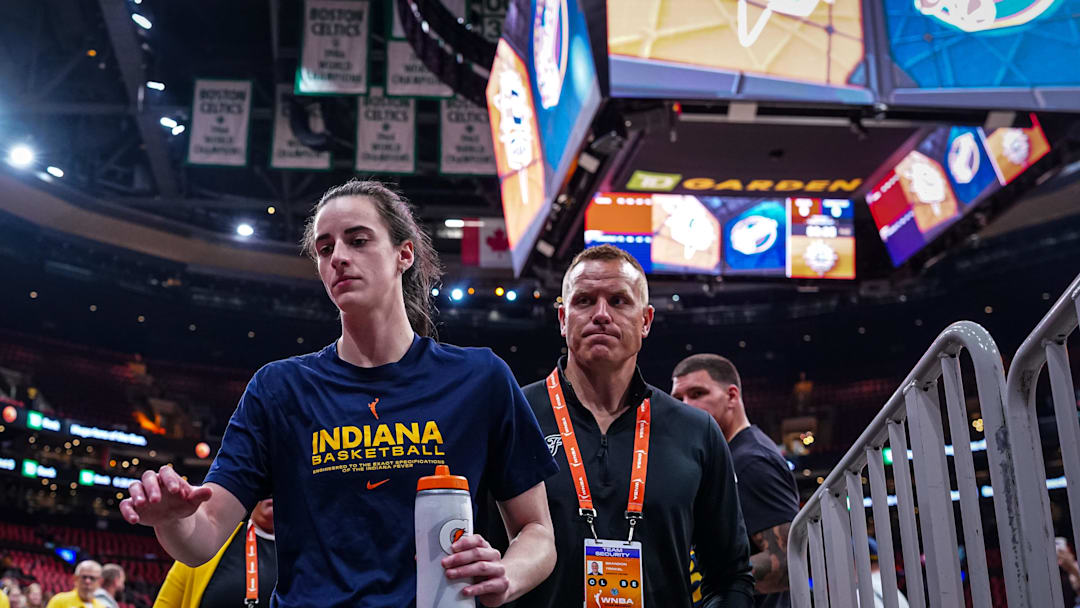 Indiana Fever guard Caitlin Clark exits the court after warm up before the start of the game against the Connecticut Sun.