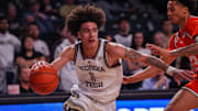 Mar 4, 2025; Atlanta, Georgia, USA; Georgia Tech Yellow Jackets guard Naithan George (1) drives to the basket against the Miami Hurricanes in the second half at McCamish Pavilion. Mandatory Credit: Brett Davis-Imagn Images