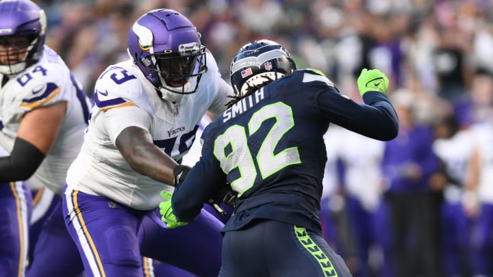 Aug 10, 2023; Seattle, Washington, USA; Minnesota Vikings offensive tackle Vederian Lowe (79) blocks Seattle Seahawks linebacker Tyreke Smith (92) during the game at Lumen Field. Mandatory Credit: Steven Bisig-USA TODAY Sports