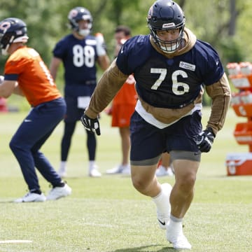 Teven Jenkins approaches the blocking dummy on a pass play drill during minicamp. Jenkins is the top Bears player without a contract for 2025.