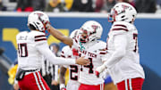 Texas Tech Red Raiders wide receiver Micah Hudson (14) celebrates a touchdown catch with Texas Tech Red Raiders quarterback Lloyd Jones III (10) during the third quarter against the West Virginia Mountaineers at Milan Puskar Stadium.