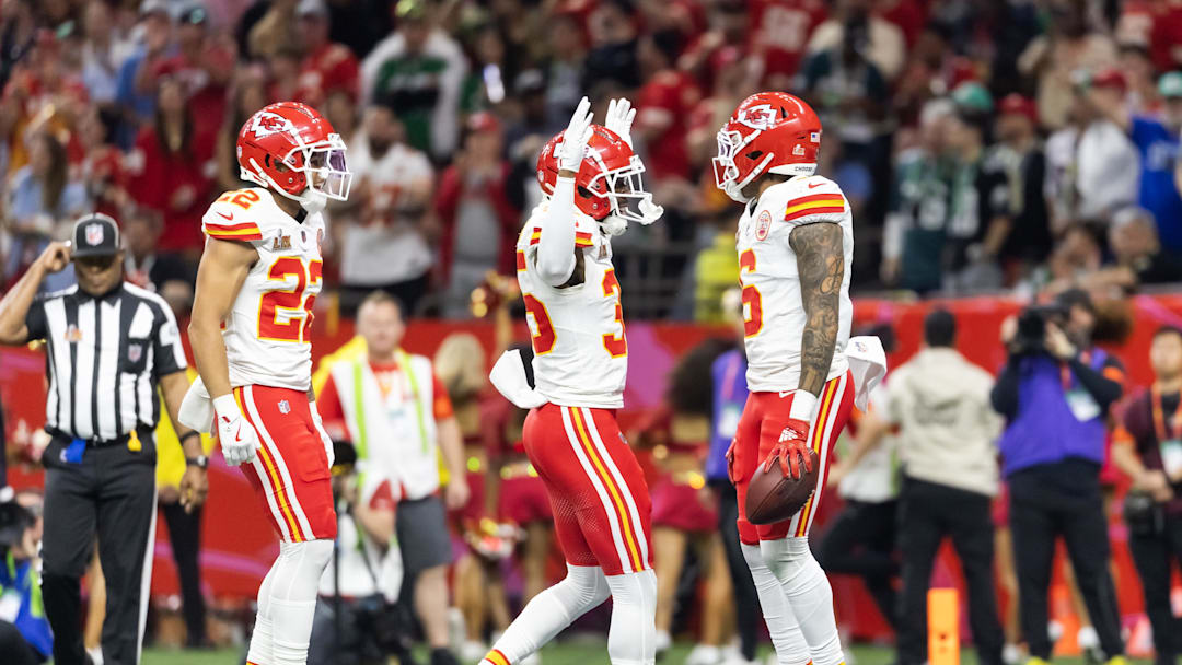 Feb 9, 2025; New Orleans, LA, USA;  Kansas City Chiefs safety Bryan Cook (6) celebrates with teammates Jaylen Watson (35) and Trent McDuffie (22) after an interception against the Philadelphia Eagles in the second quarter in Super Bowl LIX at Ceasars Superdome. Mandatory Credit: Mark J. Rebilas-Imagn Images