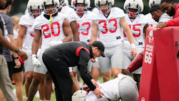 Ohio State Buckeyes safeties coach Matt Guerrieri works with linebacker Payton Pierce (26) on ball protection during the first football practice of the season at the Woody Hayes Athletic Center on July 31, 2025.