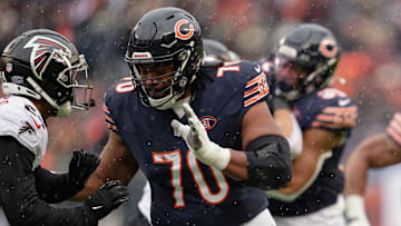 Dec 31, 2023; Chicago, Illinois, USA;  Chicago Bears offensive lineman Braxton Jones (70) blocks against the Atlanta Falcons at Soldier Field. Mandatory Credit: Jamie Sabau-Imagn Images