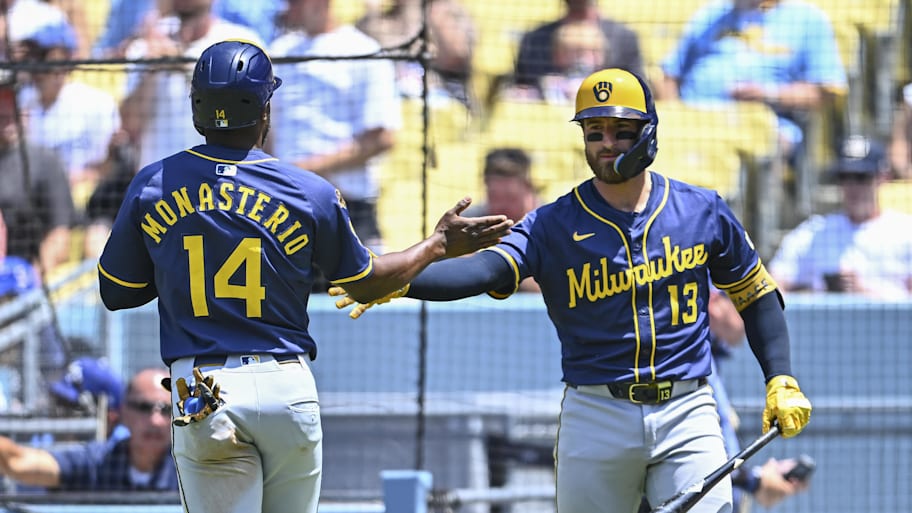Milwaukee Brewers second baseman Andruw Monasterio (14) celebrates with catcher Eric Haase (13) after scoring a run during the fourth inning at Dodger Stadium.  | Jonathan Hui-Imagn Images