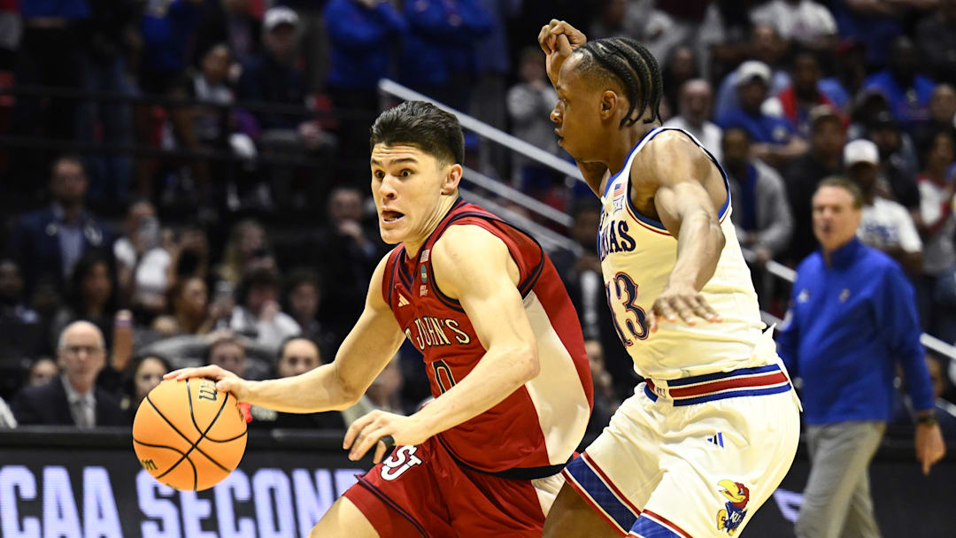 St. John's Red Storm guard Dylan Darling (0) controls the ball against Kansas Jayhawks guard Elmarko Jackson (13) the second-round game of the 2026 NCAA Tournament at Viejas Arena in San Diego, CA. St. John's Red Storm guard Dylan Darling (0) controls the ball against Kansas Jayhawks guard Elmarko Jackson (13) the second-round game of the 2026 NCAA Tournament at Viejas Arena in San Diego, CA.