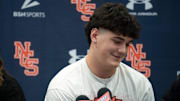 Nashville Christian's five-star quarterback Jared Curtis announces his decision to sign with Georgia with his family at his side at Nashville Christian School in Nashville, Tenn., Monday, May 5, 2025. Sister Kaitlyn Allsbrooks, left, and nephew Hudson, 2, were there to support him,.