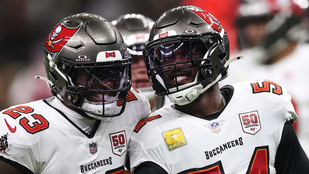Oct 26, 2025; New Orleans, Louisiana, USA; Tampa Bay Buccaneers outside linebacker Lavonte David (54) and safety Tykee Smith (23) react after a tackle during the first quarter against the New Orleans Saints at Caesars Superdome. Mandatory Credit: Stephen Lew-Imagn Images