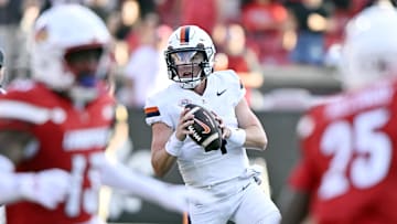 Oct 4, 2025; Louisville, Kentucky, USA; Virginia Cavaliers quarterback Chandler Morris (4) looks to pass against the Louisville Cardinals during the second half at L&N Federal Credit Union Stadium. Virginia defeated Louisville 30-27. Mandatory Credit: Jamie Rhodes-Imagn Images