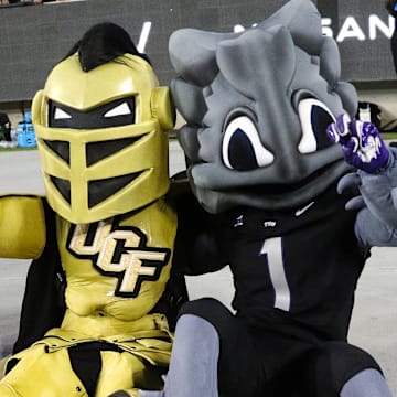 Superfrog and Knightro pose for the camera during a heated battle between UCF and TCU