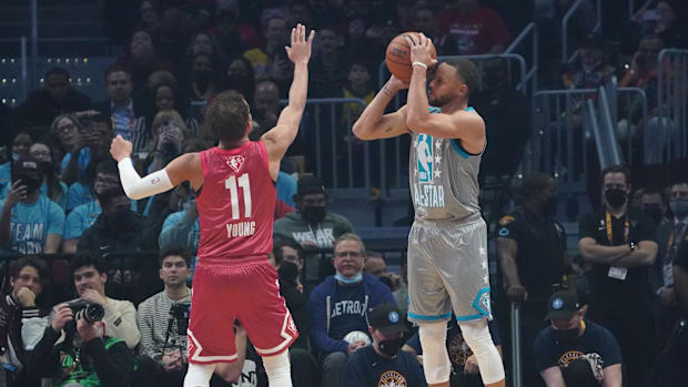 Feb 20, 2022; Cleveland, Ohio, USA; Team LeBron guard Stephen Curry (30) shoots over Atlanta Hawks guard Trae Young (11) in the first quarter of the 2022 NBA All-Star Game at Rocket Mortgage FieldHouse. Mandatory Credit: Kyle Terada-USA TODAY Sports