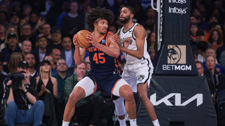 Apr 12, 2024; New York, New York, USA; New York Knicks center Jericho Sims (45) looks to the basket against Brooklyn Nets forward Mikal Bridges (1) during the first quarter at Madison Square Garden. Mandatory Credit: Vincent Carchietta-USA TODAY Sports