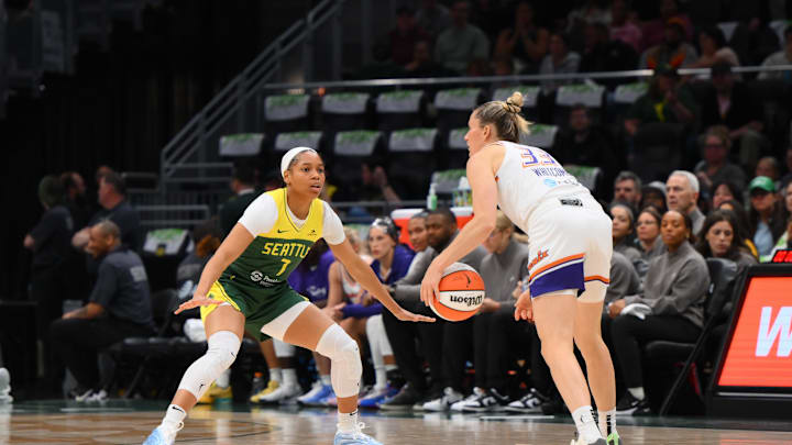 May 23, 2025; Seattle, Washington, USA; Seattle Storm guard Zia Cooke (7) defends Phoenix Mercury guard Sami Whitcomb (33) during the first half at Climate Pledge Arena. Mandatory Credit: Steven Bisig-Imagn Images