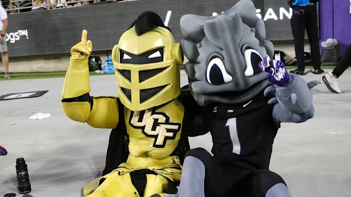 Superfrog and Knightro pose for the camera during a heated battle between UCF and TCU