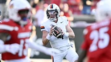Oct 4, 2025; Louisville, Kentucky, USA; Virginia Cavaliers quarterback Chandler Morris (4) looks to pass against the Louisville Cardinals during the second half at L&N Federal Credit Union Stadium. Virginia defeated Louisville 30-27. Mandatory Credit: Jamie Rhodes-Imagn Images