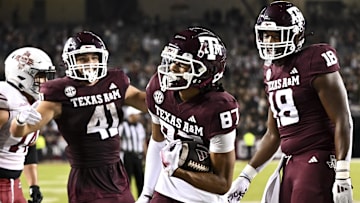 Nov 16, 2024; College Station, Texas, USA; Texas A&M Aggies wide receiver Ashton Bethel-Roman (87) reacts after scoring a touchdown during the fourth quarter against the New Mexico State Aggies at Kyle Field. Mandatory Credit: Maria Lysaker-Imagn Images 