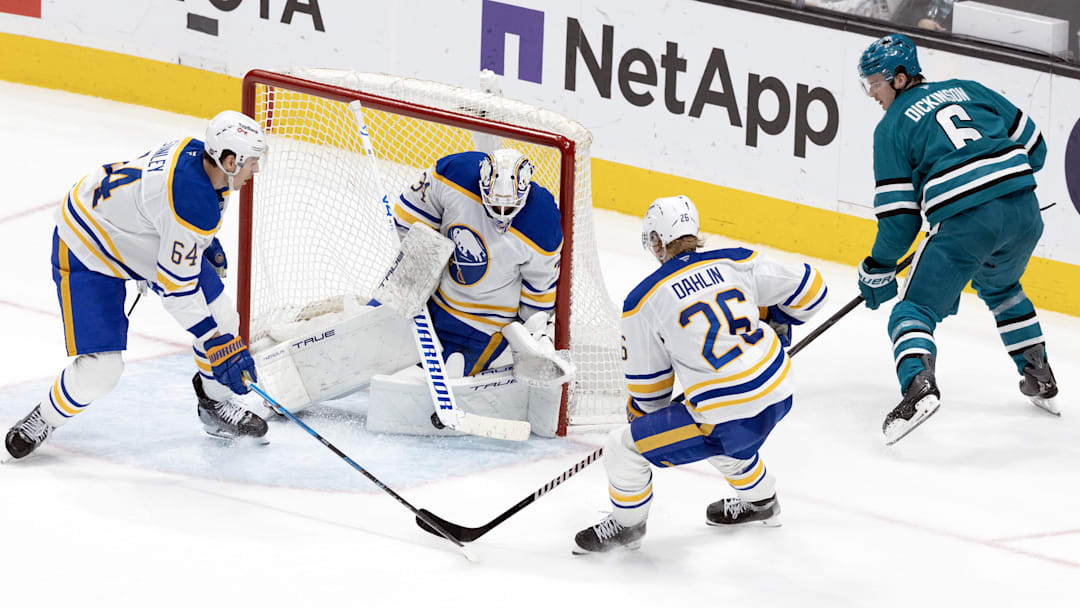 Mar 19, 2026; San Jose, California, USA; Buffalo Sabres goaltender Alex Lyon (34) makes a safe against San Jose Sharks defenseman Sam Dickinson (6) during the third period at SAP Center at San Jose. Mandatory Credit: D. Ross Cameron-Imagn Images