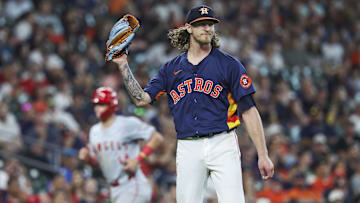 Sep 22, 2024; Houston, Texas, USA; Los Angeles Angels designated hitter Logan O'Hoppe (14) scores a run and Houston Astros relief pitcher Josh Hader (71) reacts after issuing a walk with the bases loaded during the ninth inning at Minute Maid Park. Mandatory Credit: Troy Taormina-Imagn Images