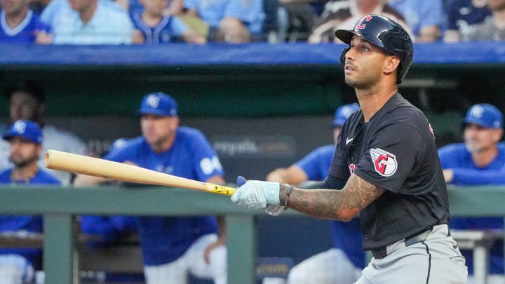 Sep 3, 2024; Kansas City, Missouri, USA; Cleveland Guardians shortstop Brayan Rocchio (4) hits a one-run sacrifice against the Kansas City Royals in the second inning at Kauffman Stadium. Mandatory Credit: Denny Medley-Imagn Images