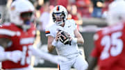 Oct 4, 2025; Louisville, Kentucky, USA; Virginia Cavaliers quarterback Chandler Morris (4) looks to pass against the Louisville Cardinals during the second half at L&N Federal Credit Union Stadium. Virginia defeated Louisville 30-27. Mandatory Credit: Jamie Rhodes-Imagn Images
