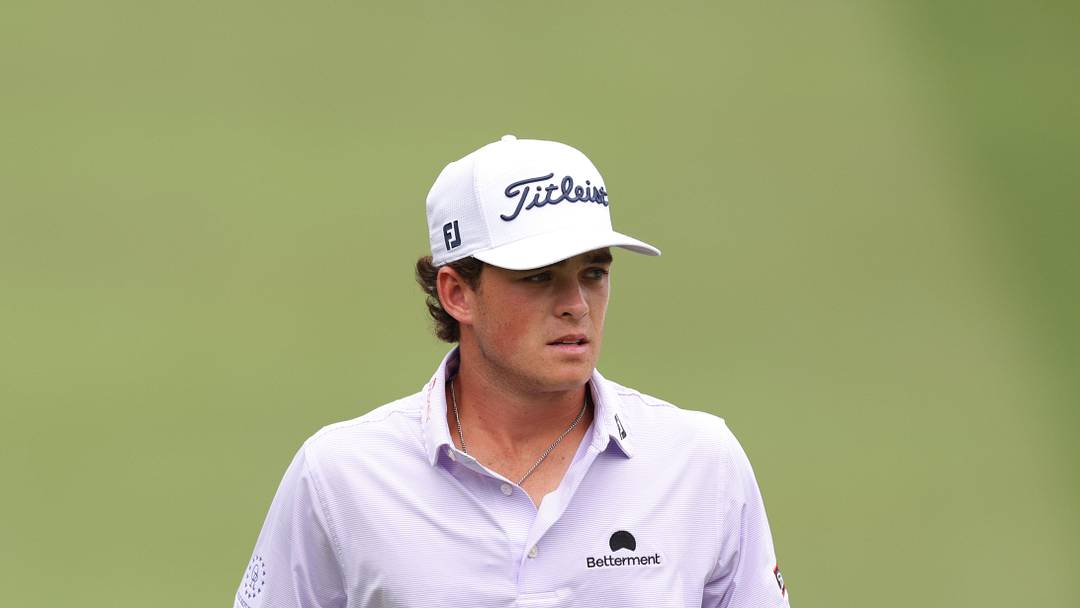 Aug 2, 2025; Greensboro, North Carolina, USA; Jackson Koivun walks onto the 18th green during the third round of the Wyndham Championship golf tournament. Mandatory Credit: Allison Lawhon-Imagn Images