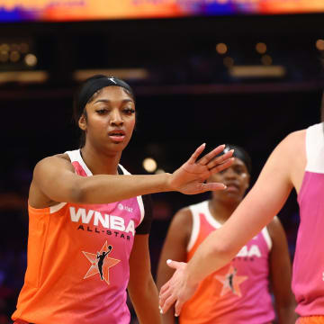 Jul 20, 2024; Phoenix, AZ, USA; Team WNBA guard Caitlin Clark (22) and Angel Reese against the USA Women's National Team during the 2024 WNBA All Star Game at Footprint Center. Mandatory Credit: Mark J. Rebilas-USA TODAY Sports