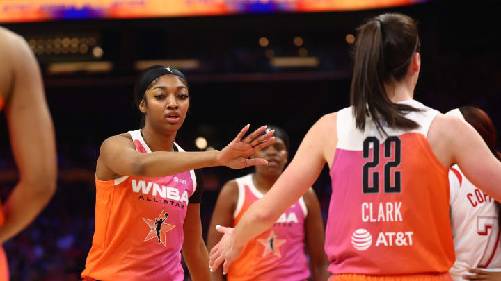 Jul 20, 2024; Phoenix, AZ, USA; Team WNBA guard Caitlin Clark (22) and Angel Reese against the USA Women's National Team during the 2024 WNBA All Star Game at Footprint Center. Mandatory Credit: Mark J. Rebilas-USA TODAY Sports