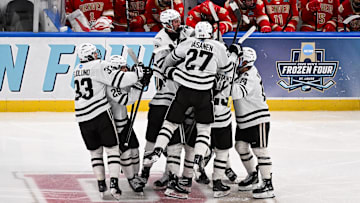 Apr 10, 2025; St. Louis, Missouri, UNITED STATES; Western Michigan Broncos forward Owen Michaels (34) celebrates with teammates after scoring the game winning goal against the Denver Pioneers in the second overtime  of the Frozen Four college ice hockey national semifinals at Enterprise Center. Mandatory Credit: Connor Hamilton-Imagn Images