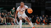 Nov 3, 2025; Coral Gables, Florida, USA; Miami Hurricanes forward Malik Reneau (5) dribbles the basketball against the Jacksonville Dolphins during the second half at Watsco Center. Mandatory Credit: Sam Navarro-Imagn Images