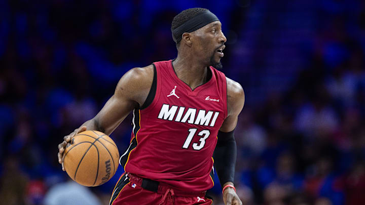 Apr 17, 2024; Philadelphia, Pennsylvania, USA; Miami Heat center Bam Adebayo (13) controls the ball against the Philadelphia 76ers during the first quarter of a play-in game of the 2024 NBA playoffs at Wells Fargo Center. Mandatory Credit: Bill Streicher-Imagn Images