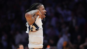 Memphis Grizzlies guard Ja Morant reacts after scoring the game-winning shot against the Miami Heat.
