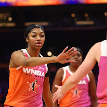 Jul 20, 2024; Phoenix, AZ, USA; Team WNBA guard Caitlin Clark (22) and Angel Reese against the USA Women's National Team during the 2024 WNBA All Star Game at Footprint Center. Mandatory Credit: Mark J. Rebilas-Imagn Images