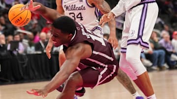 Mississippi State Bulldogs guard Josh Hubbard (12) loses the ball as Kansas State Wildcats guard Abdi Bashir Jr. (1) defends during the second half of the game at T-Mobile Center.