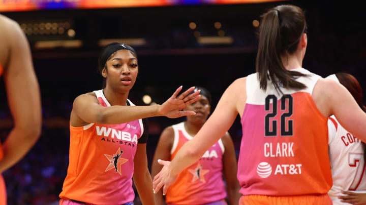 Jul 20, 2024; Phoenix, AZ, USA; Team WNBA guard Caitlin Clark (22) and Angel Reese against the USA Women's National Team during the 2024 WNBA All Star Game at Footprint Center. Mandatory Credit: Mark J. Rebilas-USA TODAY Sports