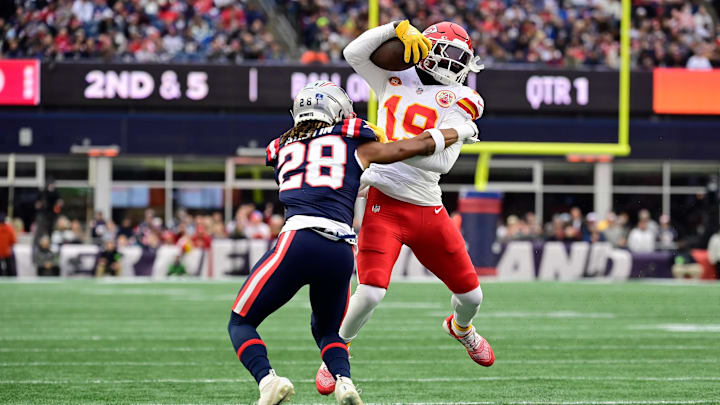 Dec 17, 2023; Foxborough, Massachusetts, USA; Kansas City Chiefs wide receiver Kadarius Toney (19) is tackled by New England Patriots cornerback Alex Austin (28) at Gillette Stadium. Mandatory Credit: Eric Canha-USA TODAY Sports