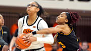 Oklahoma State Cowgirls guard Stailee Heard (32) goes past Arizona State Sun Devils guard Tyi Skinner (3) during a women's college basketball game between the Oklahoma State Cowgirls (OSU) and the Arizona State Sun Devils at Gallagher-Iba Arena in Stillwater, Okla., Wednesday, Jan. 29, 2025.