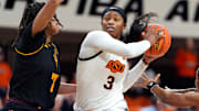 Oklahoma State Cowgirls guard Micah Gray (3) goes past Arizona State Sun Devils guard Jazion Jackson (7) during a women's college basketball game between the Oklahoma State Cowgirls (OSU) and the Arizona State Sun Devils at Gallagher-Iba Arena in Stillwater, Okla., Wednesday, Jan. 29, 2025.
