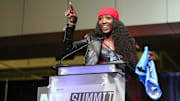  Flaujae Johnson speaks to the crowd during the NIL Summit at the Chick-fil-A College Football Hall of Fame. 