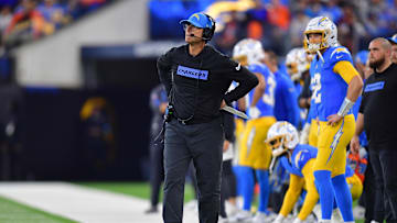 Dec 19, 2024; Inglewood, California, USA; Los Angeles Chargers head coach Jim Harbaugh watches game action against the Denver Broncos during the first half at SoFi Stadium. Mandatory Credit: Gary A. Vasquez-Imagn Images