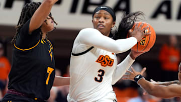 Oklahoma State Cowgirls guard Micah Gray (3) goes past Arizona State Sun Devils guard Jazion Jackson (7) during a women's college basketball game between the Oklahoma State Cowgirls (OSU) and the Arizona State Sun Devils at Gallagher-Iba Arena in Stillwater, Okla., Wednesday, Jan. 29, 2025.