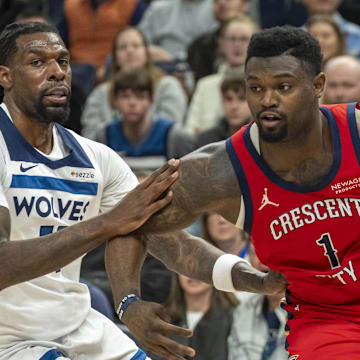 Mar 19, 2025; Minneapolis, Minnesota, USA; New Orleans Pelicans forward Zion Williamson (1) drives to the basket past Minnesota Timberwolves center Naz Reid (11) in the second half at Target Center. Mandatory Credit: Jesse Johnson-Imagn Images
