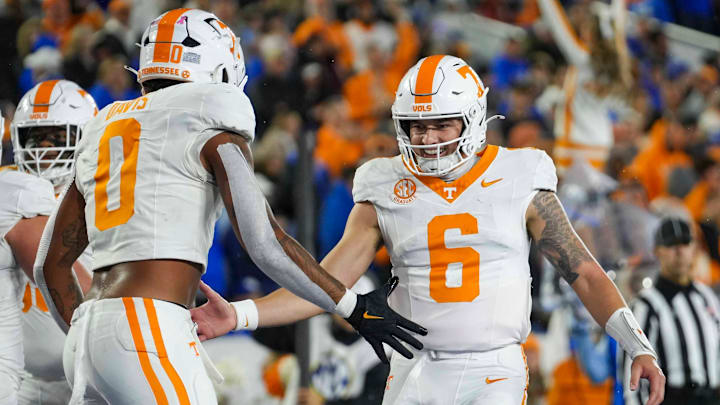 Tennessee quarterback Joey Aguilar (6) and Tennessee tight end Ethan Davis (0) celebrate after a touchdown during a NCAA football game against Kentucky at Kroger Field in Lexington, Kentucky on Oct. 25, 2025.