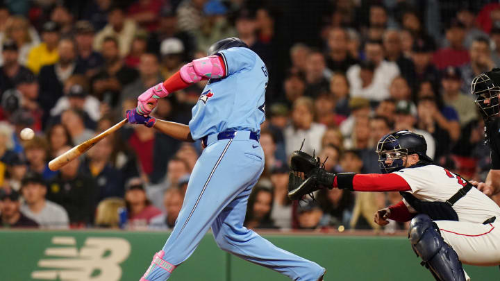 Toronto Blue Jays designated hitter Vladimir Guerrero Jr. (27) hits a double to drive in a run against the Boston Red Sox  in the third inning at Fenway Park on Aug 29.